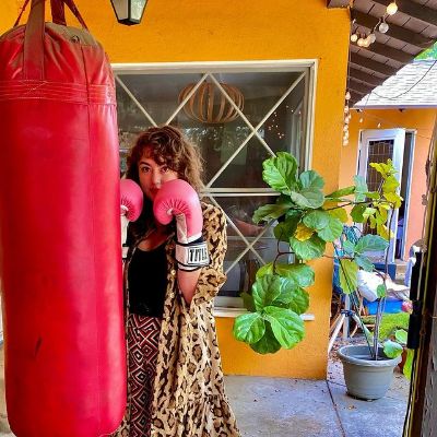 Picture of Ava Emanuelle Billows with her punching bag and gloves